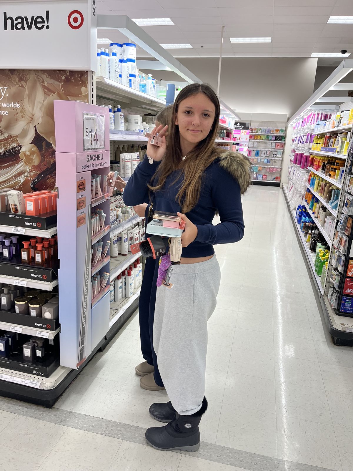 Ruby in a Target aisle, arms full of finds